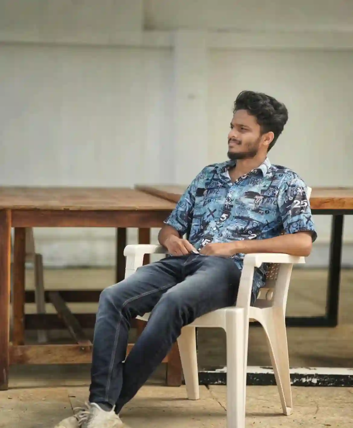 a man sitting in a chair certified Top digital marketing strategist in kannur